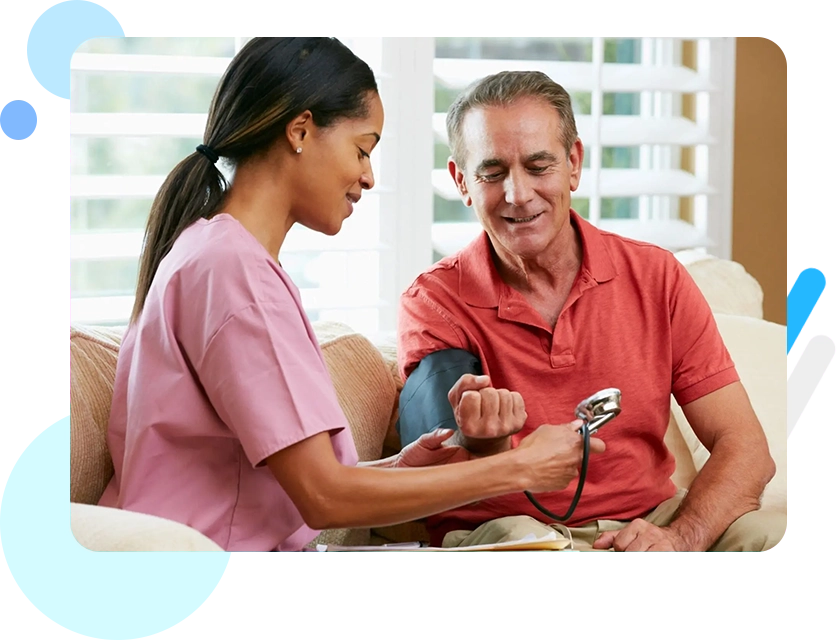 A nurse is checking the blood pressure of an older man.